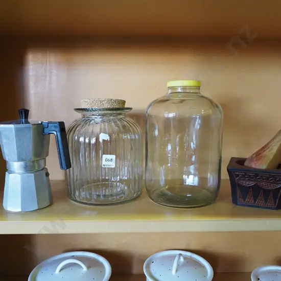 stove top espresso, storage jars, wooden mortar and pestle