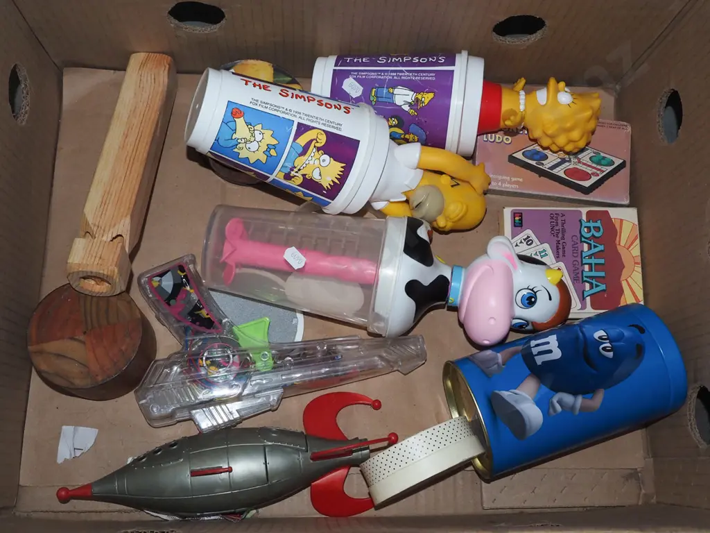 box; wooden train whistle, toy gun, Simpsons lidded drinking cups etc Image 1++