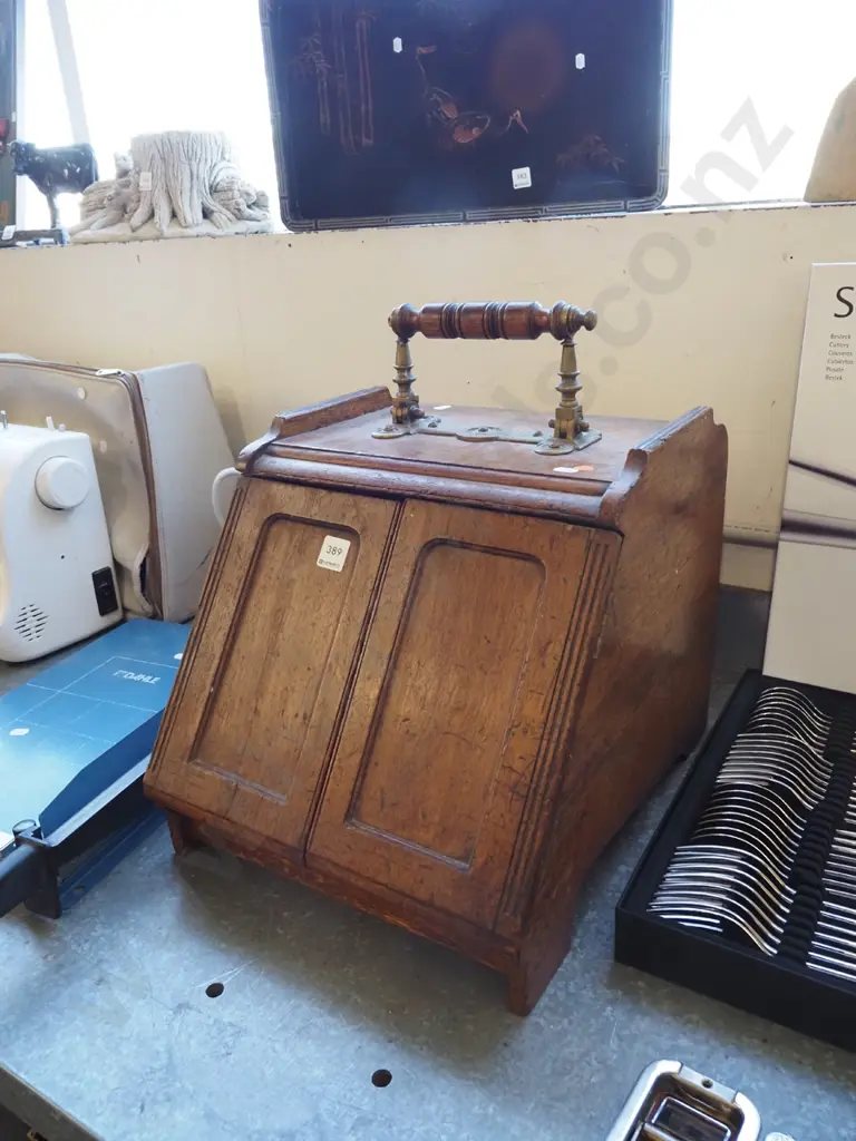 vintage oak coal scuttle with brass door-opening mechanism connected to brass and timber top handle, with tin liner. Image 1++