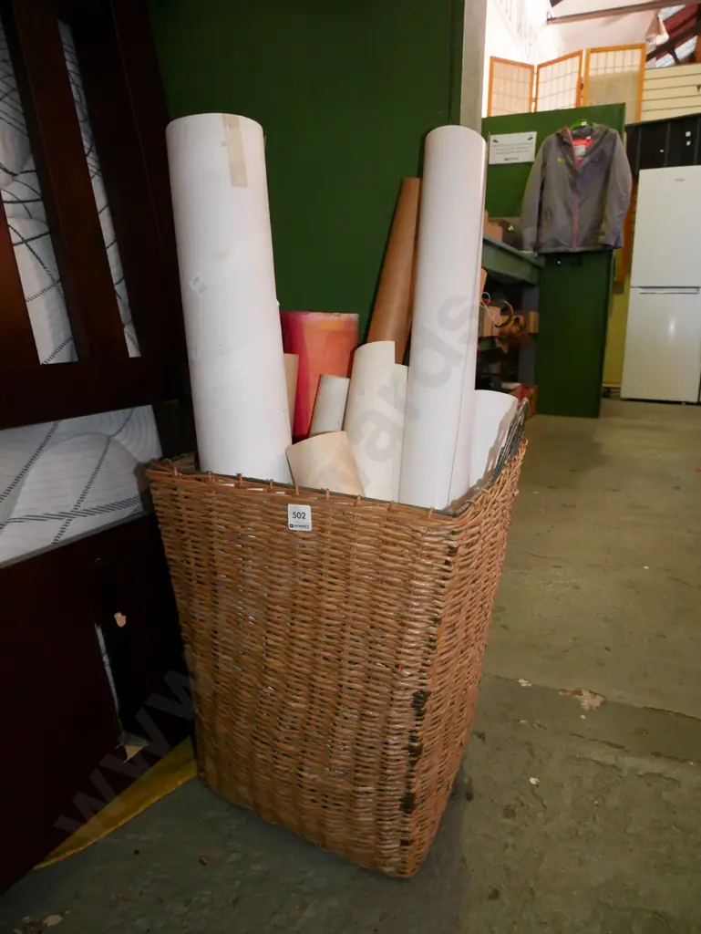 cane basket with cardboard tubes, rolled up prints Image 1++