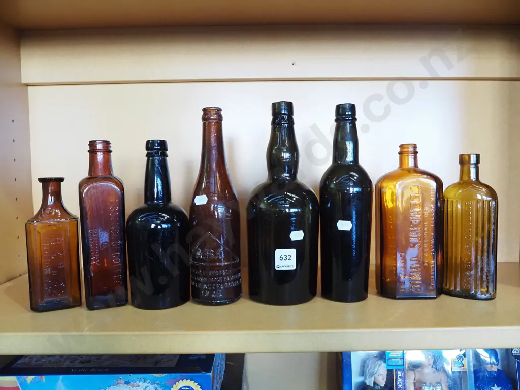 shelf of vintage amber bottles Image 1++