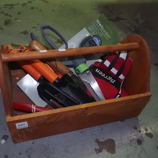 wooden basket with garden tools, gloves