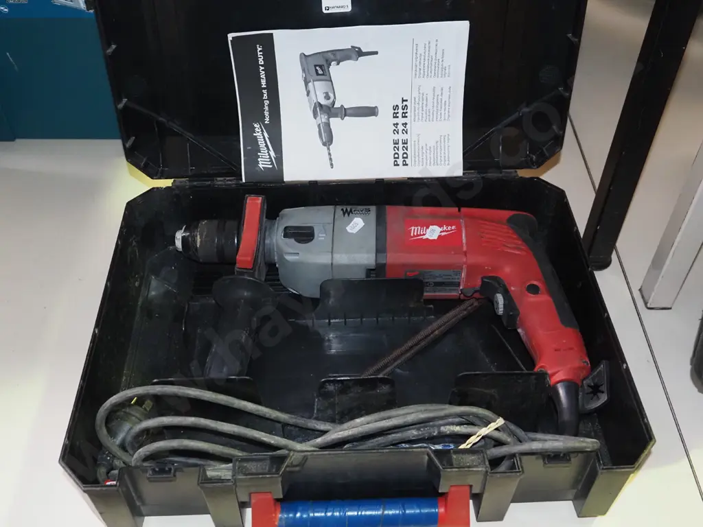 cased Milwaukee hammer drill Image 1++