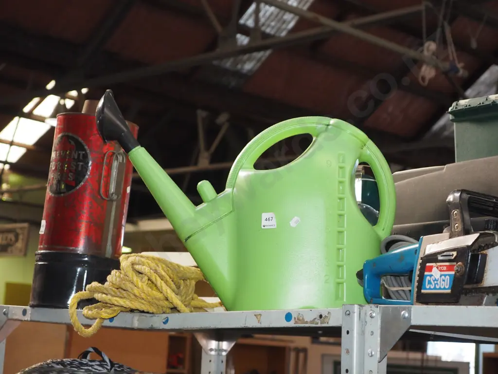 green plastic watering can Image 1++