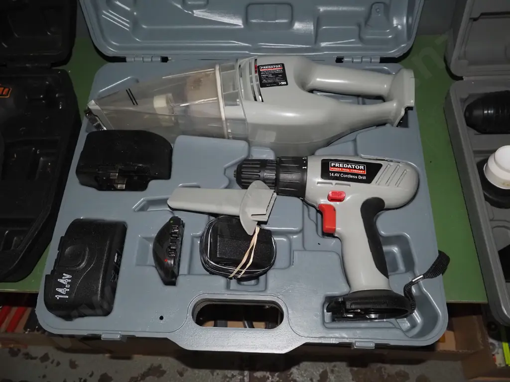 cased Predator battery powered tool set; drill hand held vacuum Image 1++