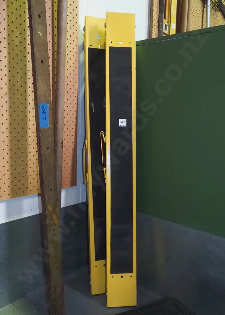 pair of yellow foldaway saw horses Image 1++