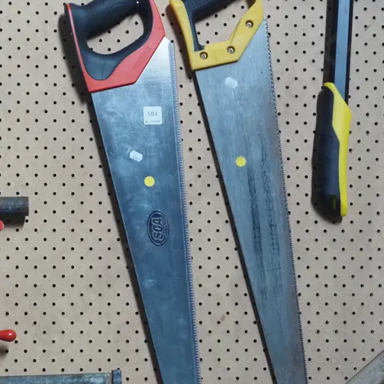 2x hand saws - yellow dots