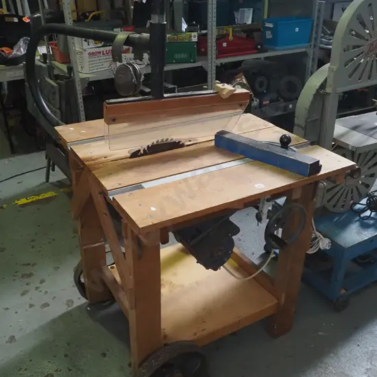 homemade wooden based table saw with Peltor ear muffs