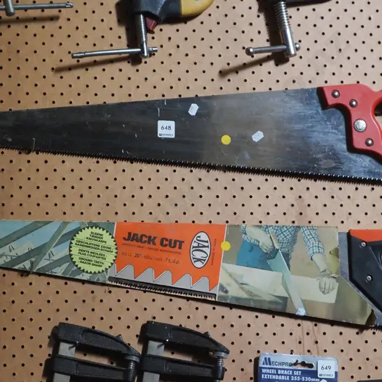 2x hand saws - yellow dots