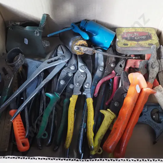 box; tin snips, plumbers wrenches, builder's square etc