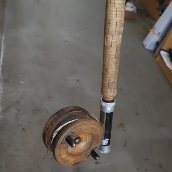 vintage bamboo fly rod and wheel