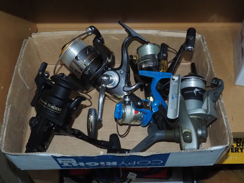box of spinning fishing reels Image 1++