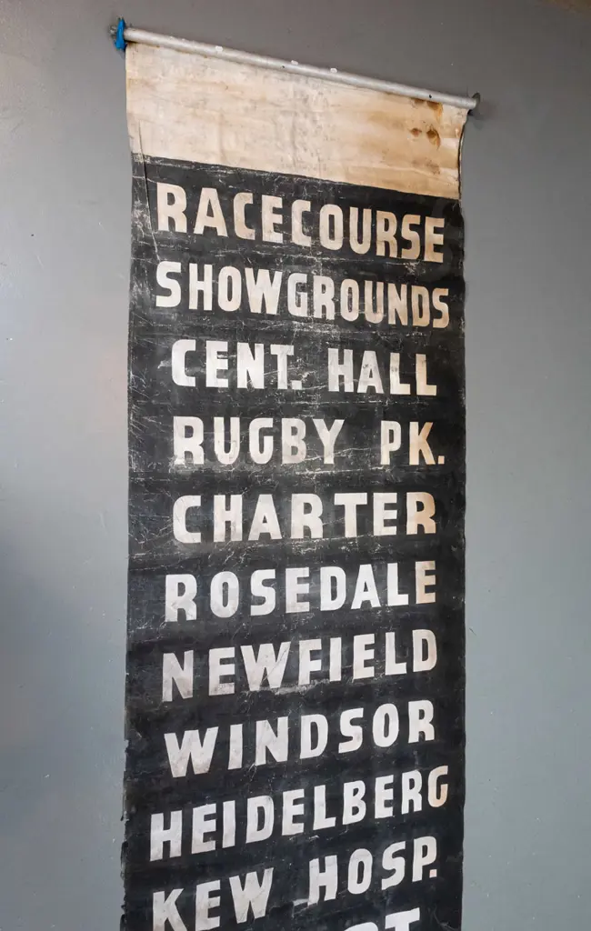 vintage Invercargill fabric bus blind on metal rollers - white on black lettering, significant wear and areas of damage, Image 1++