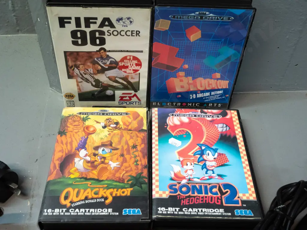 Sega Megadrive (Genesis) game console with 3 controllers with 8 games, 4 with original boxes, and a Sega branded laser Image 1++