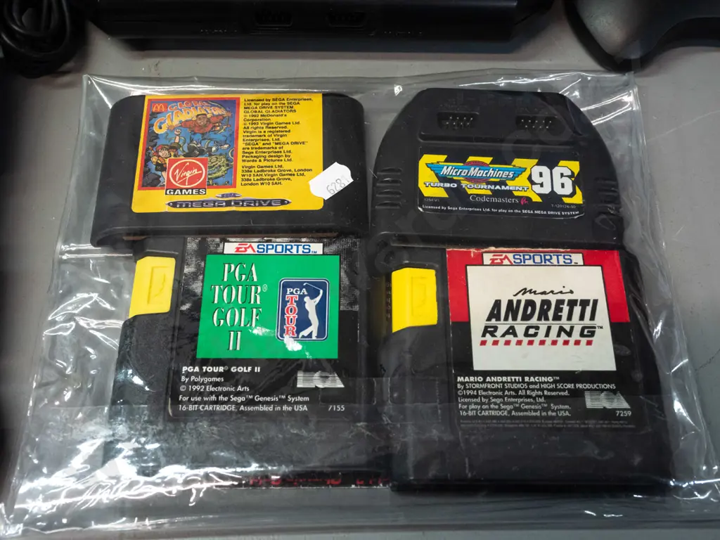Sega Megadrive (Genesis) game console with 3 controllers with 8 games, 4 with original boxes, and a Sega branded laser Image 1++
