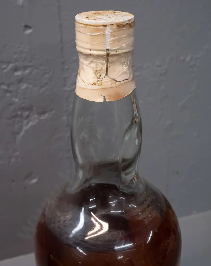 very large 4.5 litre Highland Queen Scotch whisky bottle - "1992 Christmas" label on base - has tape around seal, unsure Image 1++