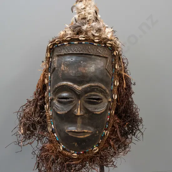 painted and carved wooden mask - Chokwe people, Angola/Congo - w/ beads, shells, feathers and raffia. Some deterioration