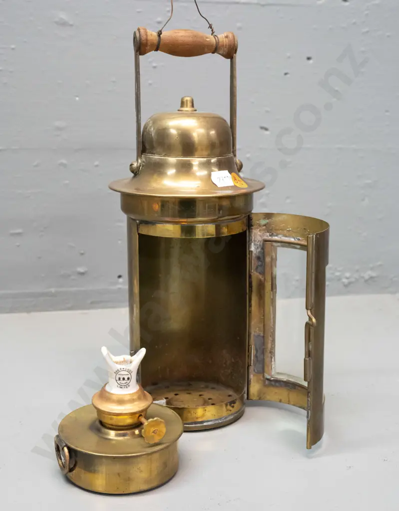 brass lantern with timber carry handle, curved glass door, ceramic and brass lamp insert - marked Sherwoods Ltd. H-260 Image 1++