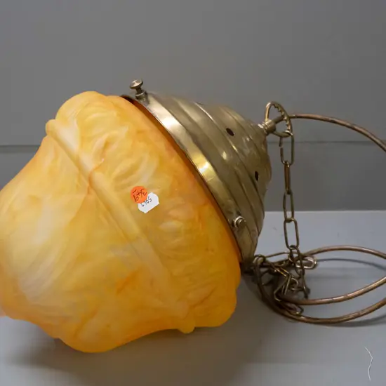 amber & yellow mottled glass pendant hanging light with embossed motifs, brass journal and chain. H-360 D-300