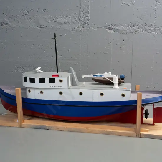 large motorised model boat - marked Lady Beverley, with crane arm and inflatable boat. Motor untested.