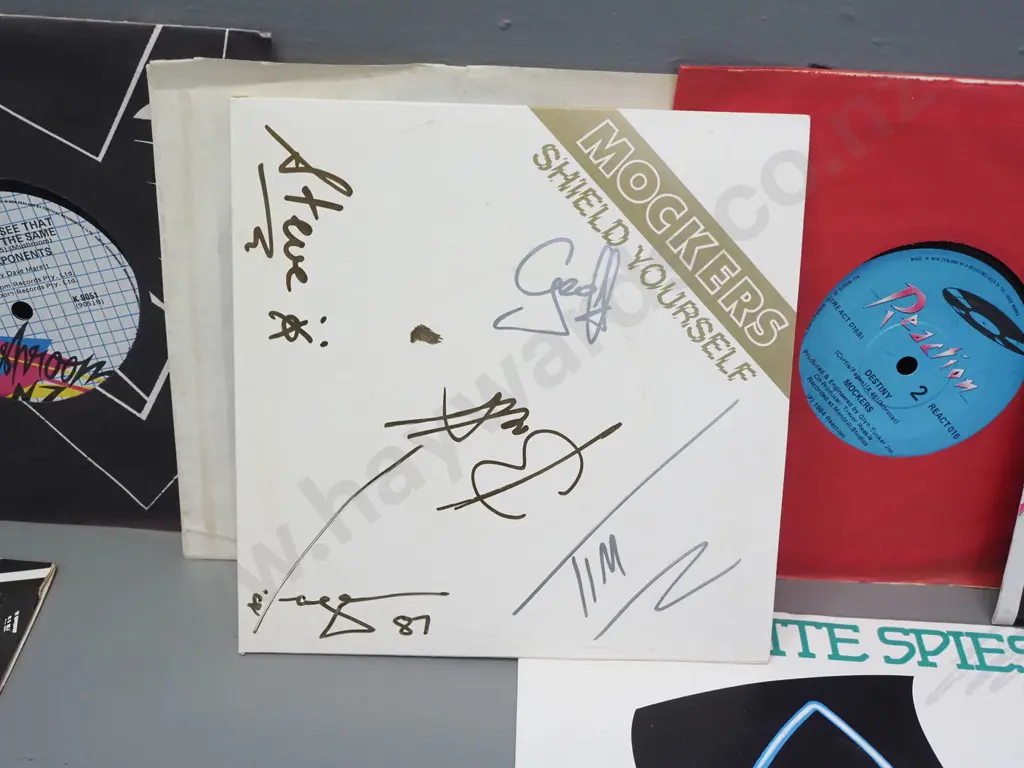 9x 45 RPM singles, NZ artists - Mockers - Shield Yourself signed by band, Dance Exponents, Satellite Spies, etc. Image 1++
