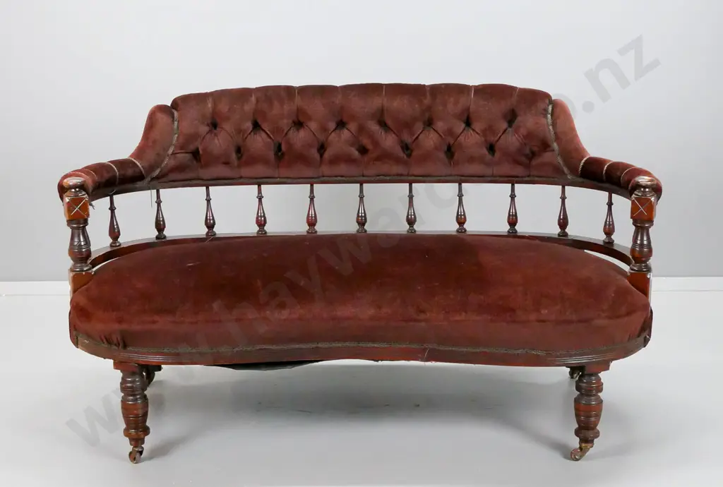 restorer's Edwardian tub couch with turned spindle back, deep button back, porcelain casters. Old repairs to back, loose Image 1++