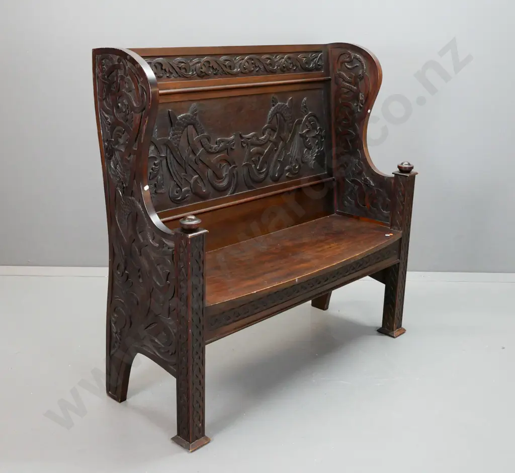 colonial New Zealand stained kauri settle with carved Celtic style dragons and motifs, turned armrest finials, bow-front Image 1++
