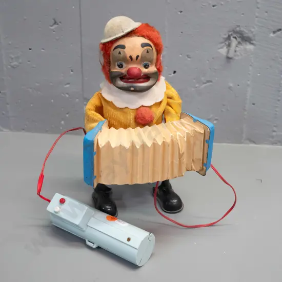 retro Japanese battery powered clown with squeezebox  - with wired remote, working and makes sound. Some marks and wear
