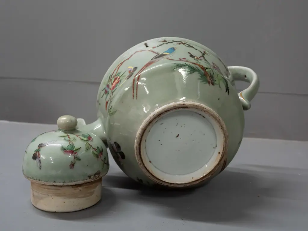 19th century Chinese teapot with raised enamel decoration - insects, birds, floral motifs on celadon ground. Has stapled Image 1++