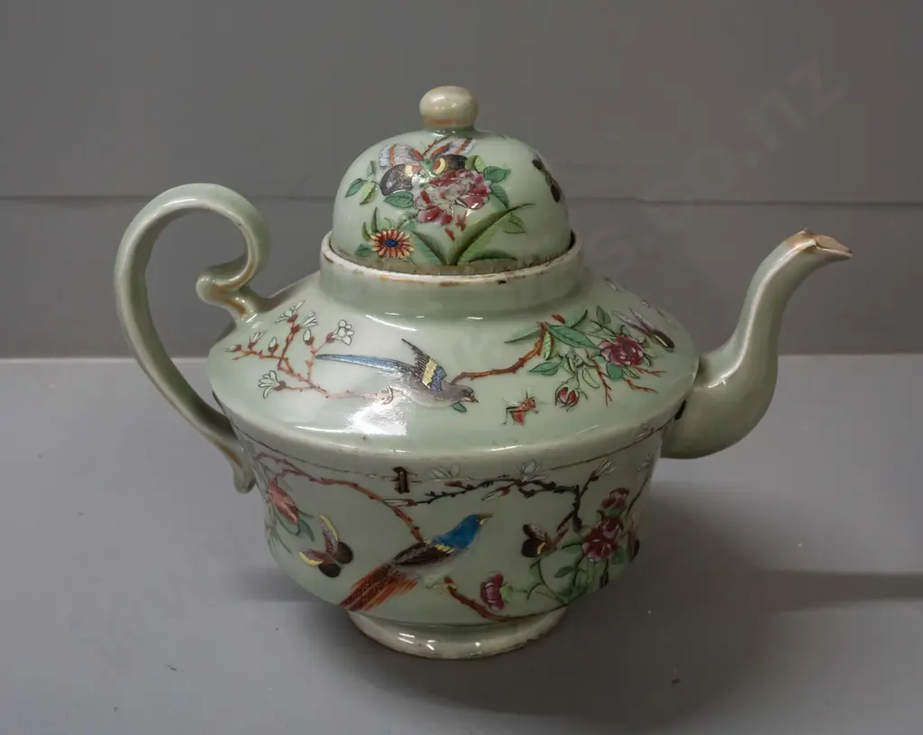 19th century Chinese teapot with raised enamel decoration - insects, birds, floral motifs on celadon ground. Has stapled Image 1++
