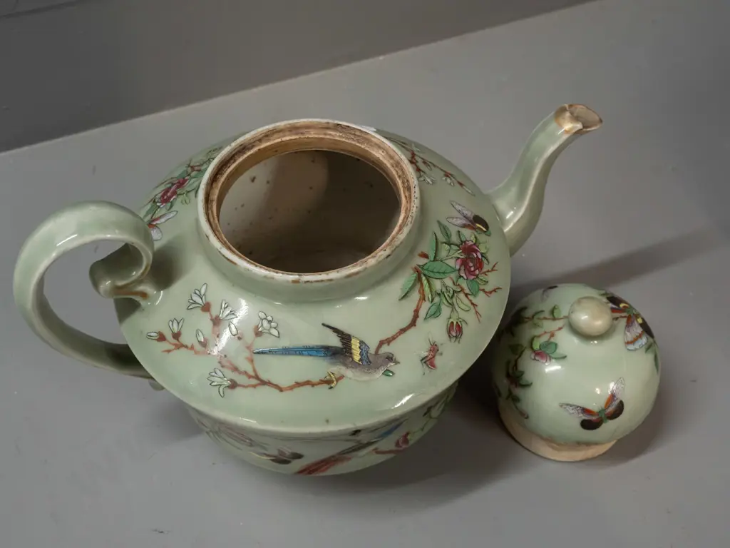 19th century Chinese teapot with raised enamel decoration - insects, birds, floral motifs on celadon ground. Has stapled Image 1++
