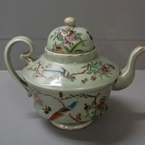 19th century Chinese teapot with raised enamel decoration - insects, birds, floral motifs on celadon ground. Has stapled