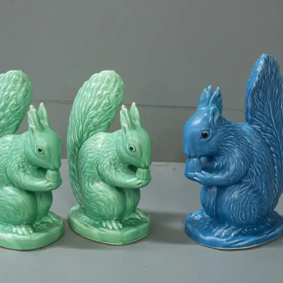 3 Sylvac squirrel figures - 2 green marked 1144 and blue marked 1145. Glaze nibbles to ears on both green ones and fleck