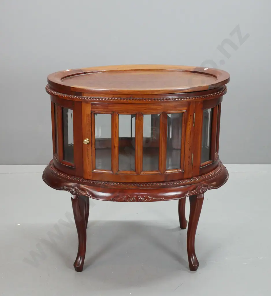 reproduction mahogany oval glazed serving or display table with lift-off tray top, 16 bevelled glass panels, doors on 2 Image 1++