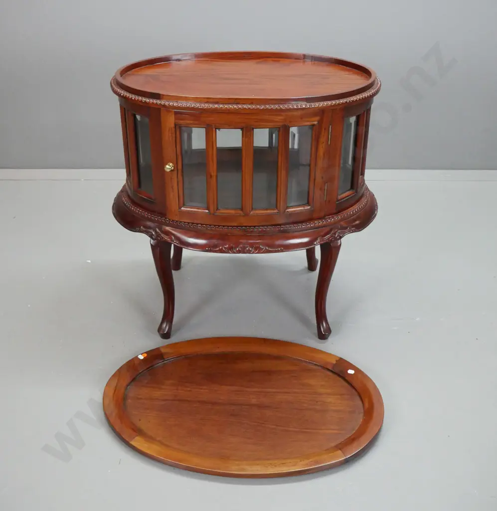 reproduction mahogany oval glazed serving or display table with lift-off tray top, 16 bevelled glass panels, doors on 2 Image 1++