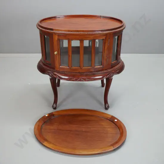 reproduction mahogany oval glazed serving or display table with lift-off tray top, 16 bevelled glass panels, doors on 2