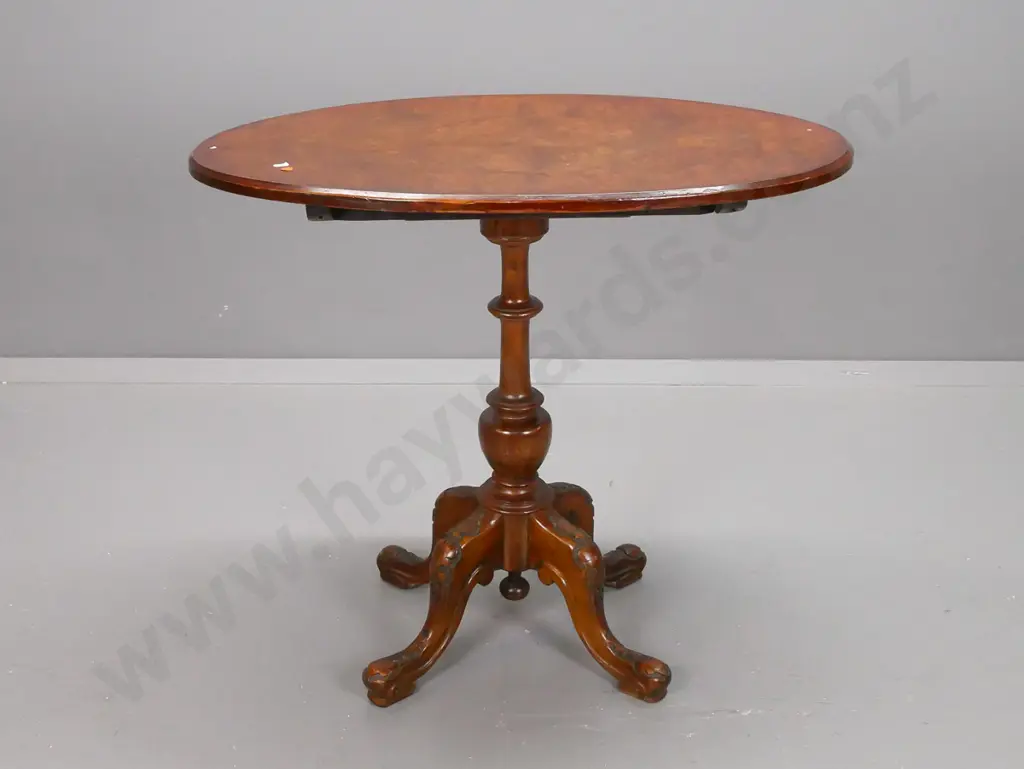 Victorian walnut oval top wine table on elm turned pedestal base with 4 carved cab legs - some veneer loss to underside Image 1++