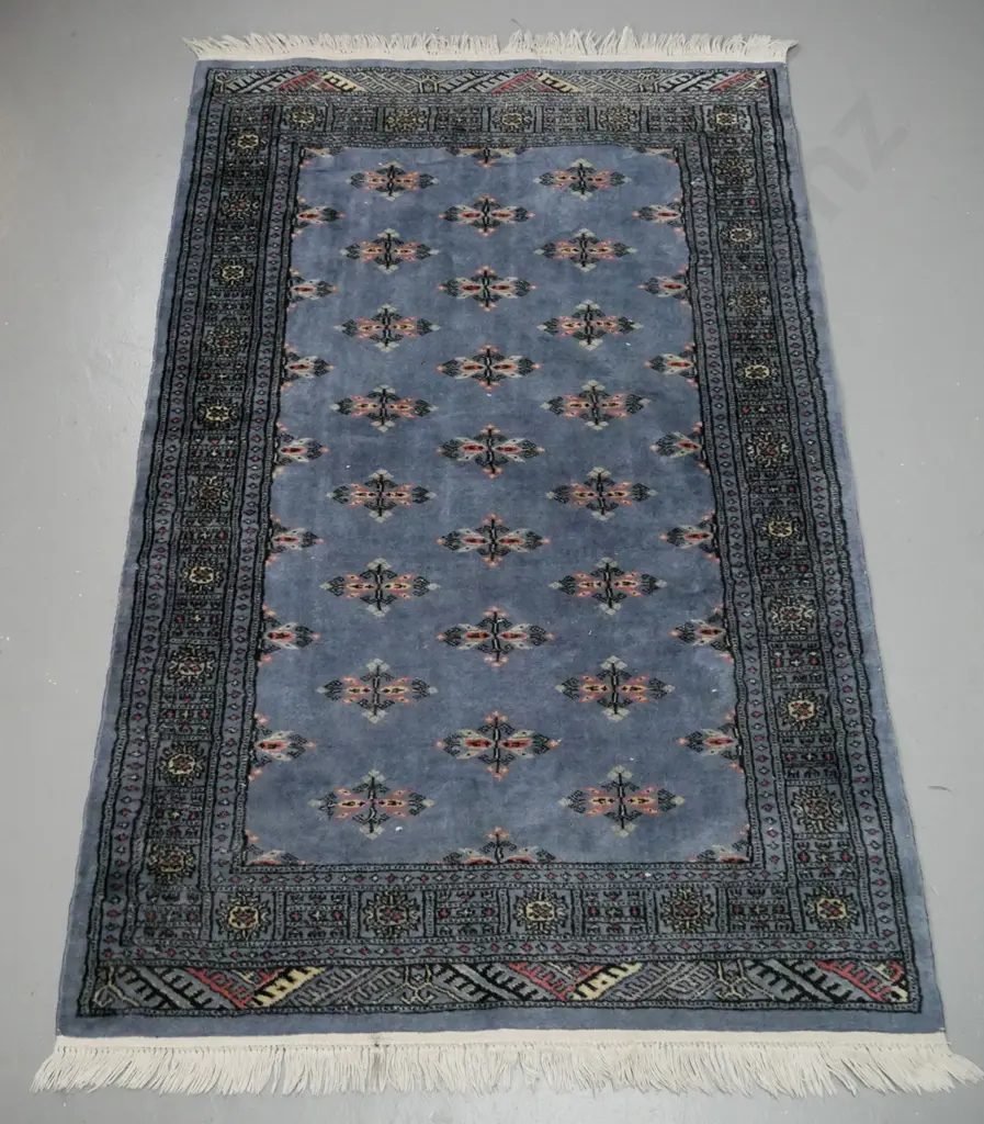 hand-knotted wool Persian style floor rug - blue with red, black & ivory tones. Wear to edges and to border at one end Image 1++