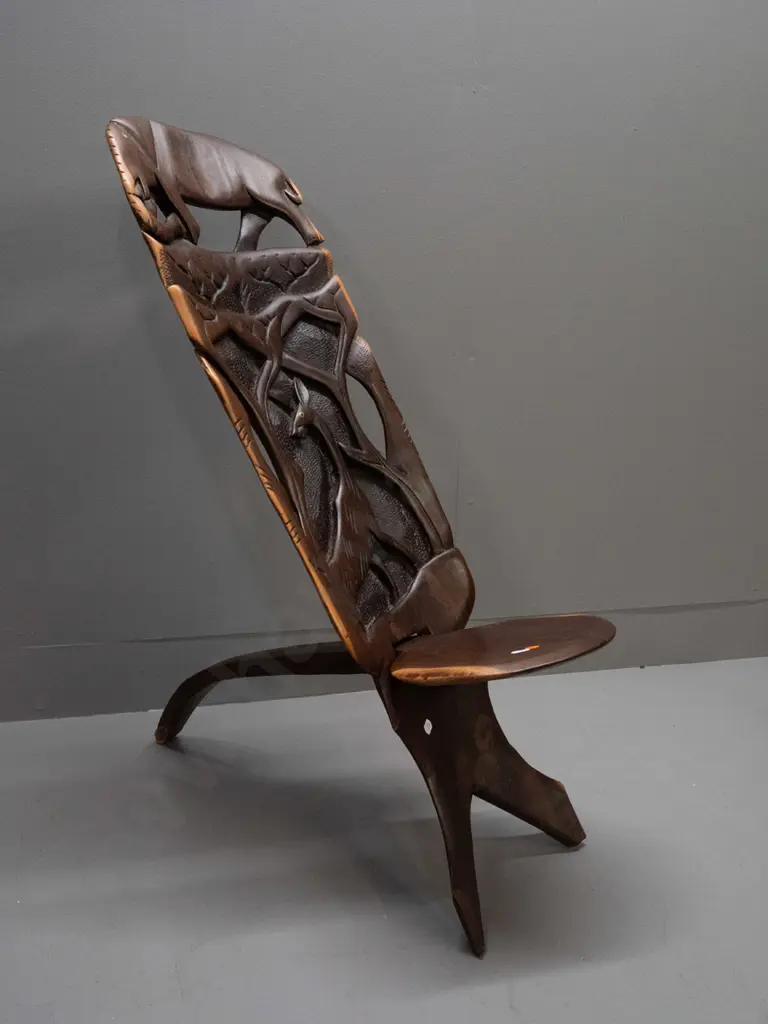 2-piece collapsible carved and pierced African hardwood chair with elephant, antelope, etc. - small crack in seat H-770 Image 1++