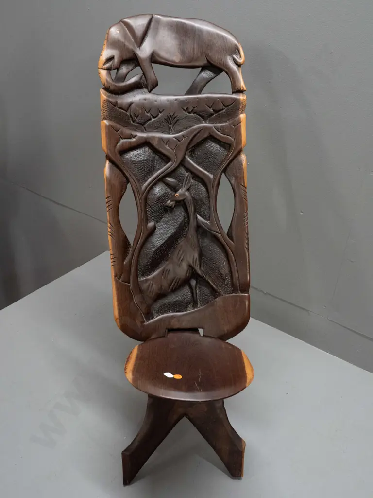 2-piece collapsible carved and pierced African hardwood chair with elephant, antelope, etc. - small crack in seat H-770 Image 1++