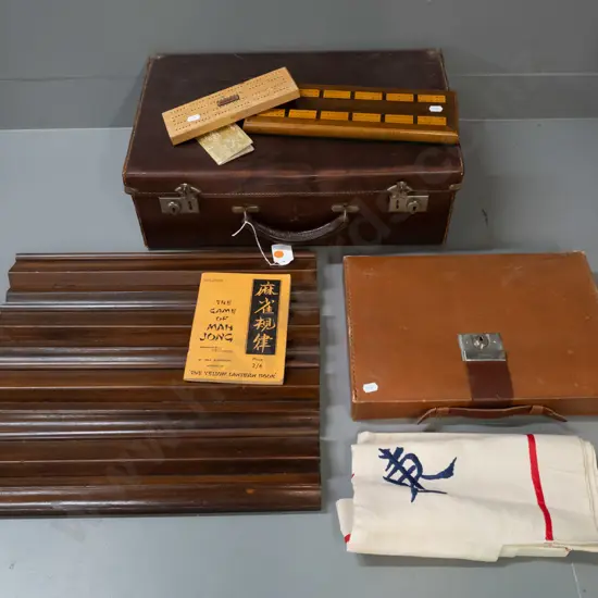 vintage mahjong set with leather cased set of pieces and counters, 4 (mahogany?) racks and embroidered linen playing