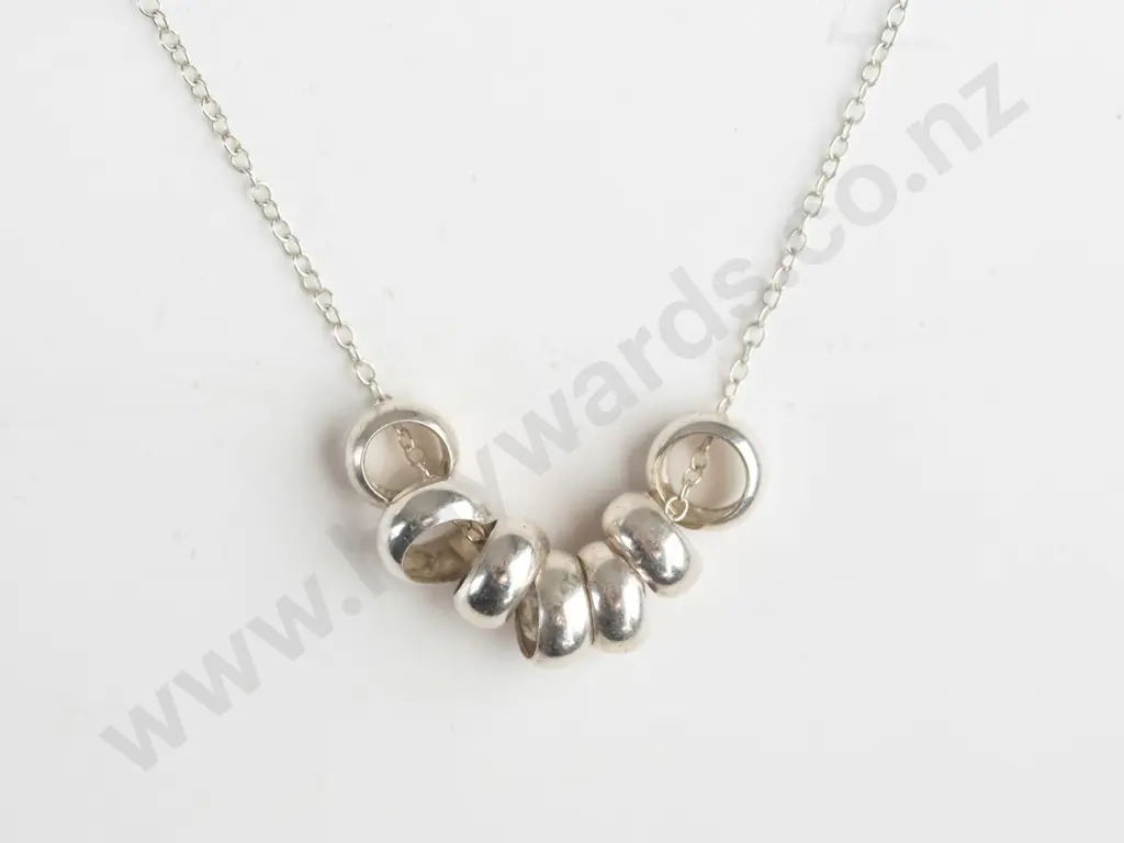 silver necklace with 7 small rings chain stamped 925 Image 1++