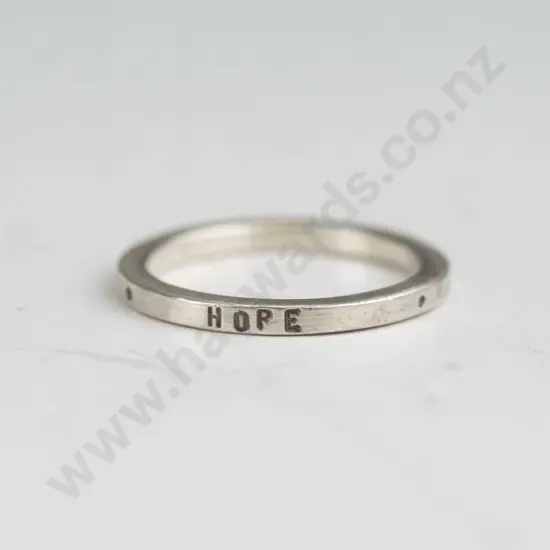 silver ring engraved 'love, hope, faith'   stamped 925