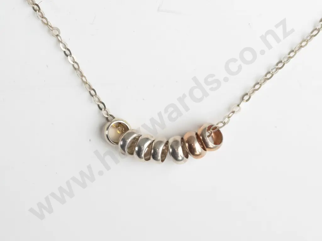 silver necklace with 7 small rings Image 1++