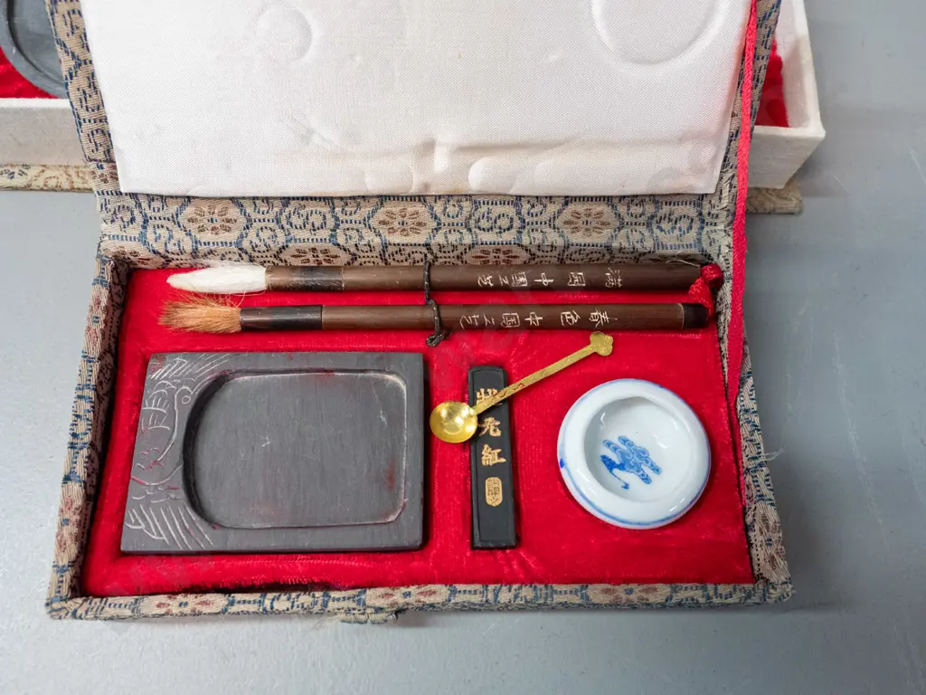 2 Chinese painting / desk sets in fabric covered cases, w/ various porcelain containers, brushes, pallette, soapstone Image 1++