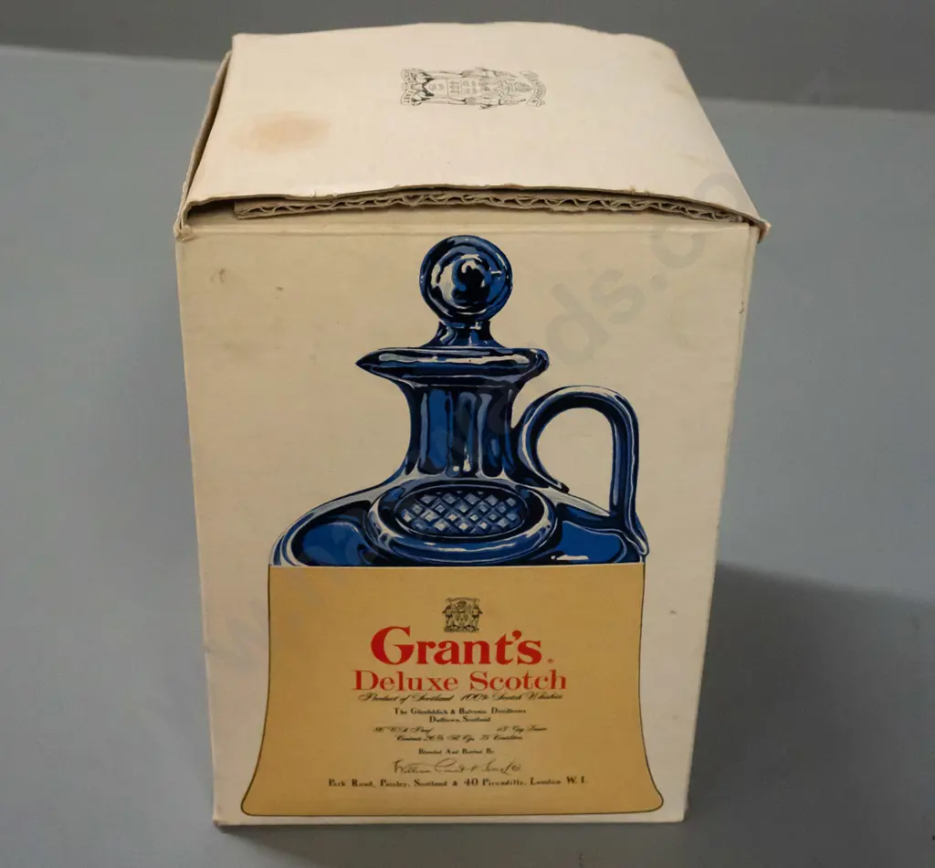 Grant's scotch whisky in handled jug, still sealed, with unused stopper and original box. Jug H-190 Image 1++