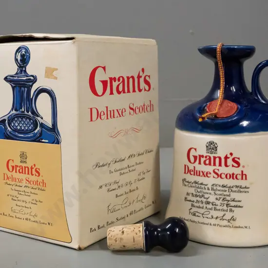 Grant's scotch whisky in handled jug, still sealed, with unused stopper and original box. Jug H-190