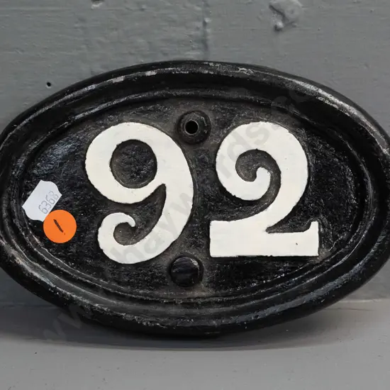 heavy cast metal oval (railway?) plaque with white-painted "92" on black background, has 2 mounting holes H-110 W-180