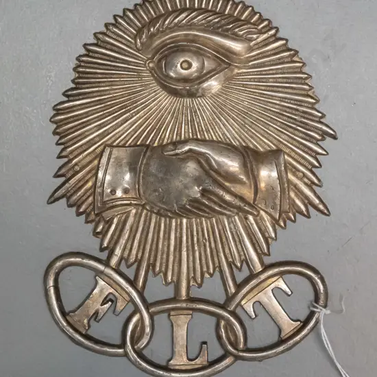 cast metal plaque with Oddfellows hands & eye imagery and letters FLT (Friendship, Love, and Truth) H155 W120