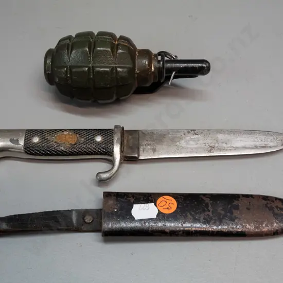 reproduction or dummy grenade and a knife marked Solingen / Armeso / Made in Germany, with metal scabbard, has had
